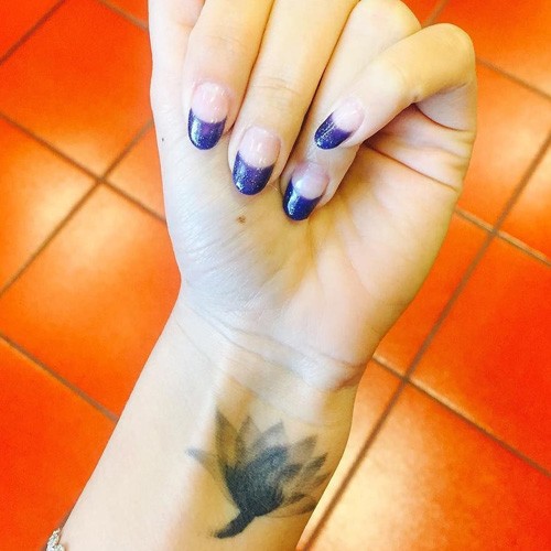 Janel Parrish's lotus tattoo